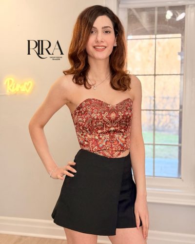 Red Persian carpet corset top with rich pattern and structured satin design